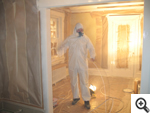 Mike masking and finishing the interior of a house.